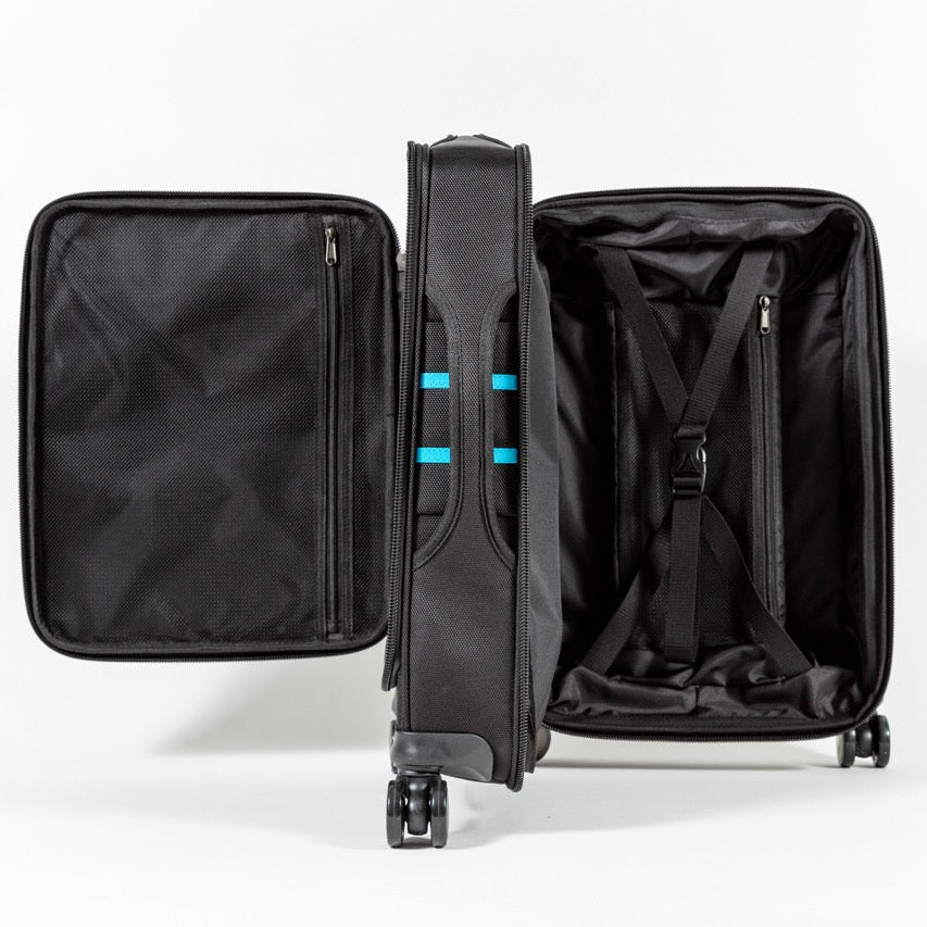 Side view of the Flipside suitcase with its two independent openings and center partition