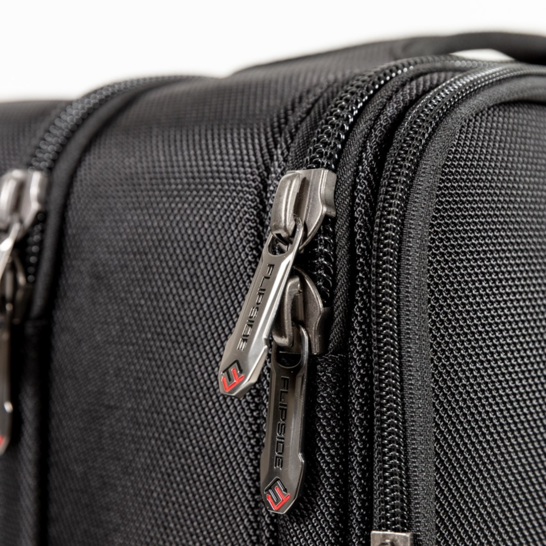 Detailed view of the Flipside zipper pulls and precisely finished zipper tracks